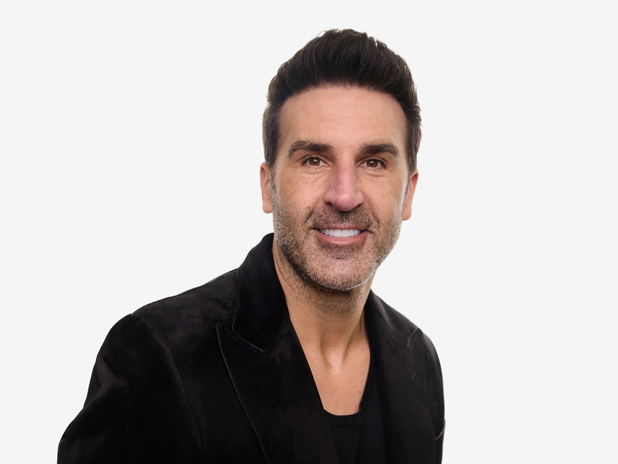 Man wearing a black jacket on a white background