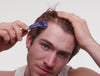 man using microderm roller