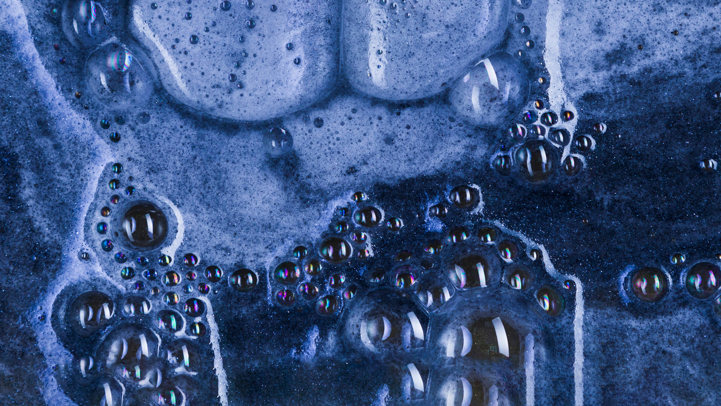 Close-up of blue bubbles on a textured surface